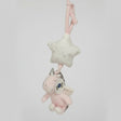 Pink plush unicorn hanging below a cream glitter star pull toy with a fabric crib strap