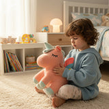 Coral pink squishy unicorn with a mint green horn and hooves resting on a child's lap
