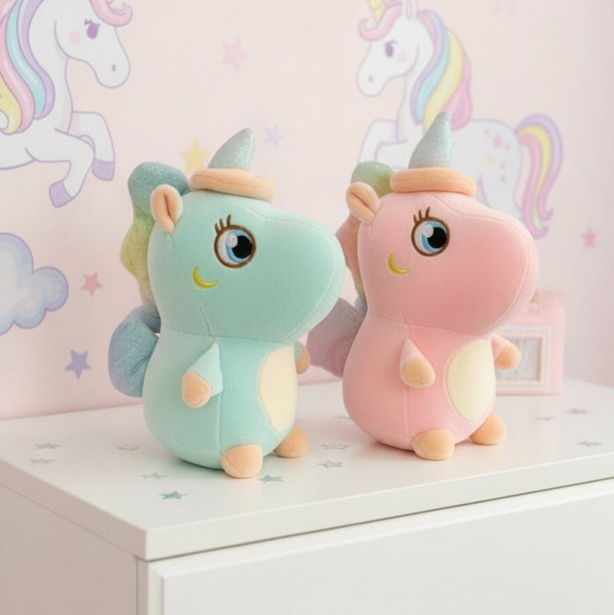 Mint and pink standing unicorn plushies side by side on a white dresser