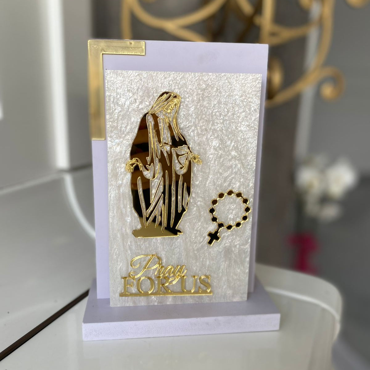 Standing Virgin with open lowered hands and no halo, lettered Pray For Us