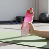 Frosted ombre water bottle in pink printed with motivational word panels