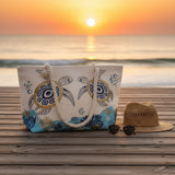 Beach bag with turtle design on a sandy beach
