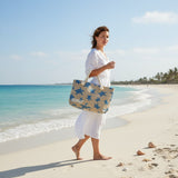 Woman walking on a beach holding a tote bag with 'Beirut' printed on it.