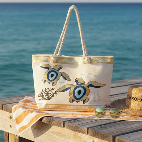 Beach bag with turtle design on a wooden bench by the ocean