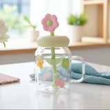 Clear jar with a pink flower-shaped lid on a table with a blurred background