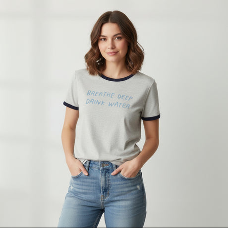 White t-shirt with blue text on a gray background