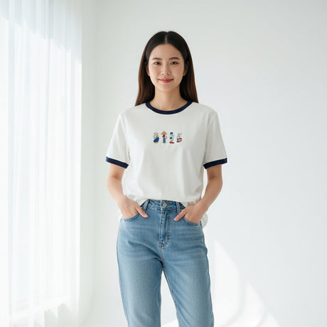 White dress with embroidered characters on a dark surface