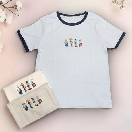 White t-shirt with embroidered design and matching pouch on a pink background with 'Chill Cotton' text.