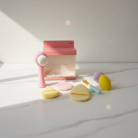 Make up blenders set staged on a marble table