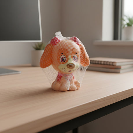 Plush dog toy in a mesh bag on a wooden surface