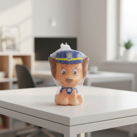 Toy figure of a police officer in a mesh bag on a cardboard surface