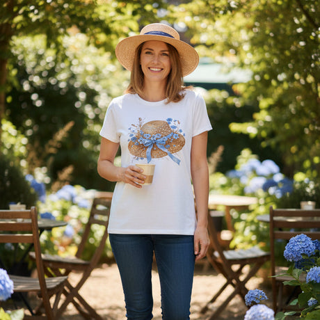 White t-shirt with a decorative hat design on a dark surface