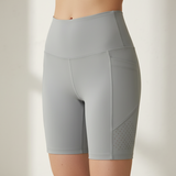 Gray athletic shorts on a plain background