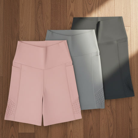 Biker shorts in pink, gray, and black with dumbbells on a white background, labeled 'Jack Gifts'.