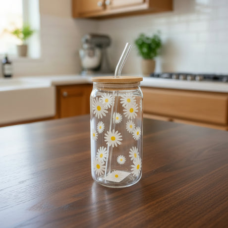 Clear glass jar with floral design and wooden lid on, staged on a kitchen countertop