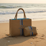 Two woven bags with blue stripes on a wooden surface