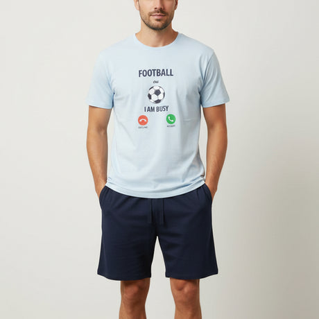 White t-shirt with text and graphics on a tiled floor