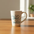 Mug with 'To the best dad in the world' text on a store shelf.