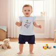 Baby standing in a room with toys and a teddy bear