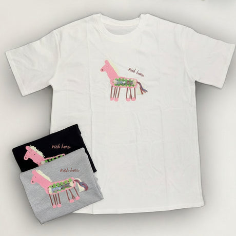 White t-shirt with pink llama design and gray pouch with matching design on a white background.