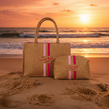 Woven bags with pink straps held by a hand in a store setting