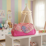 Pink cosmetic bag with butterfly design on a store shelf with various items.