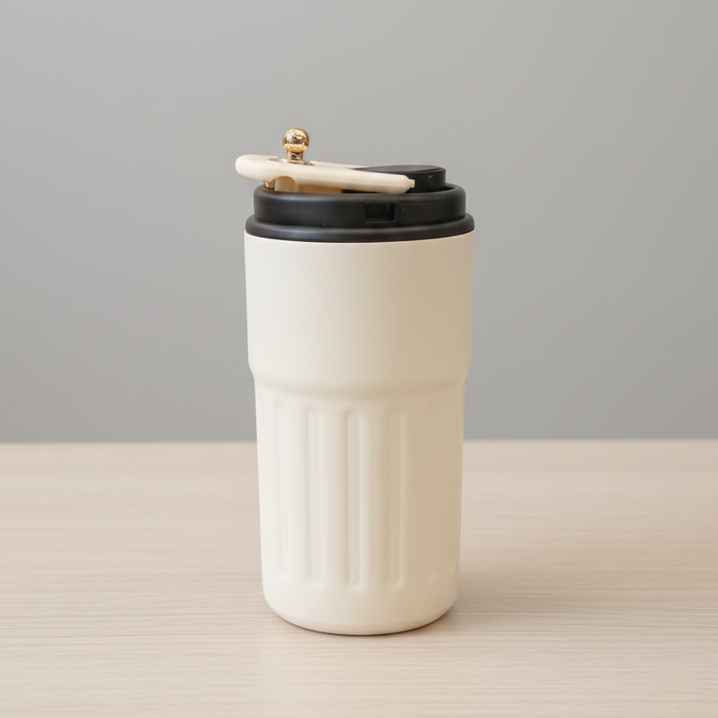 White travel mug with black lid and wooden handle on a light gray background