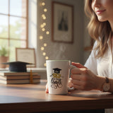 Person holding a mug with 'The Sky is the Limit' text in a cozy indoor setting.