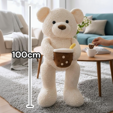 Cream boucle teddy bear standing upright with a brown boba cup plush tucked against its chest, shown at 100cm