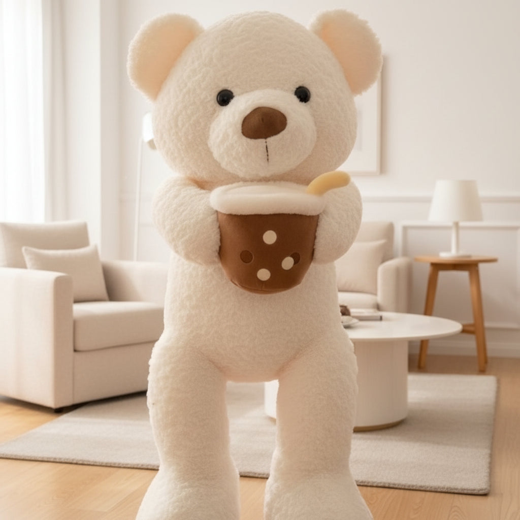 Cream white curly teddy bear holding a brown boba cup plush, shown close up