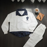 White sweatshirt with a navy check collar styled with white jeans