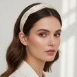 White braided twist headband worn with long waves