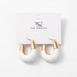 Chunky white enamel hoop earrings with polished gold tone tops on a card