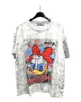 Oversized white tshirt with a colorful front print of Daisy Duck character, displayed on a hanger