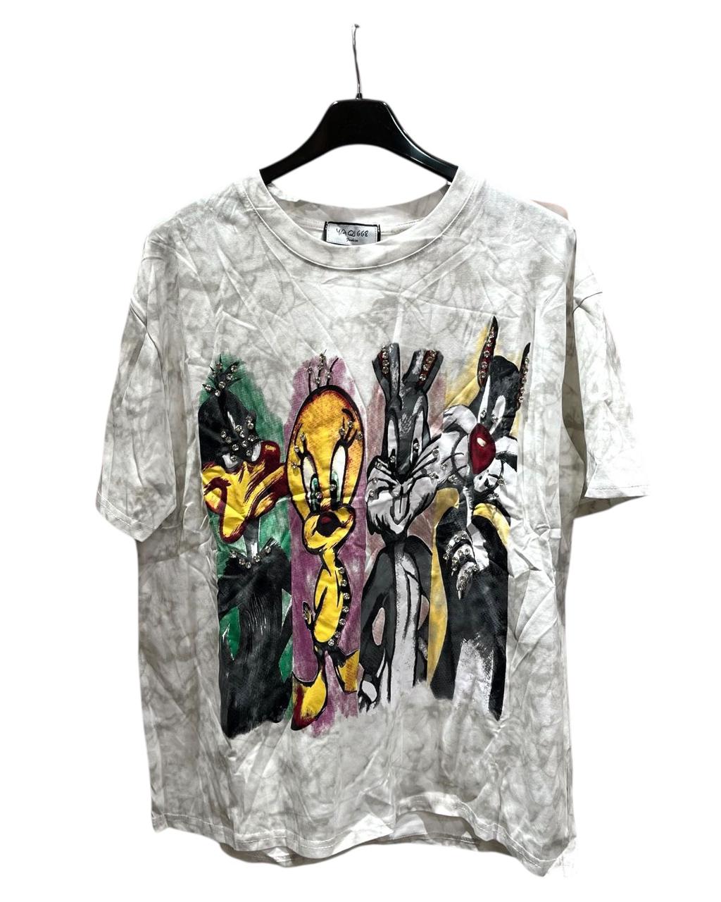 An oversized white tshirt with a colorful graphic print of various Disney characters