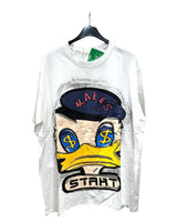 White oversized tshirt with a colorful front print of Donald Duck wearing a hat