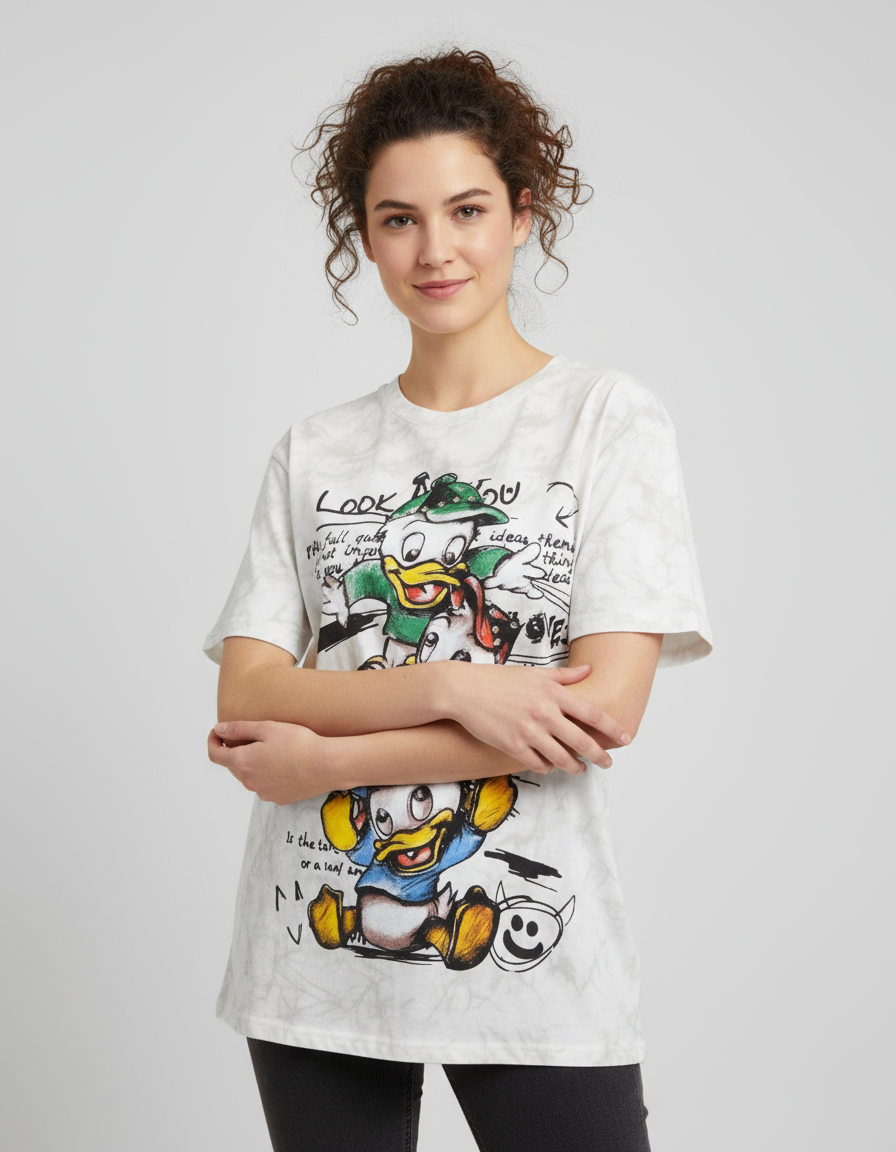 Person wearing a white tshirt with cartoon duck character print on a plain background