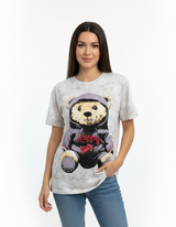 Woman wearing a tshirt with a bear graphic and 'Happy' text on a white background