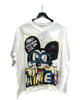 A white oversized tshirt with a graphic print of Mickey Mouse wearing glasses