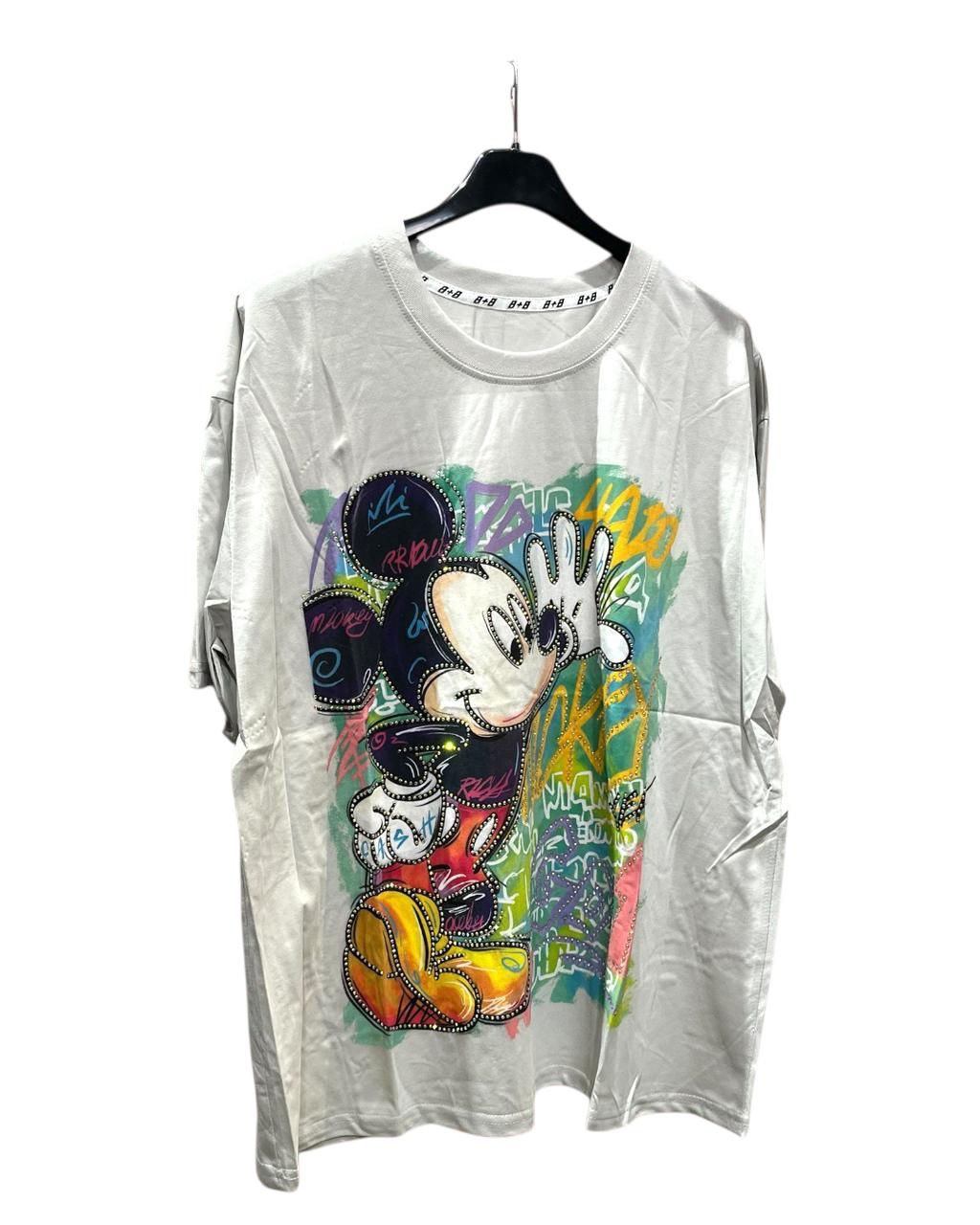 A white oversized tshirt featuring a colorful graphic of Mickey Mouse on the front