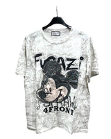 Oversized white tshirt with a graphic of Mickey Mouse and text on a hanger