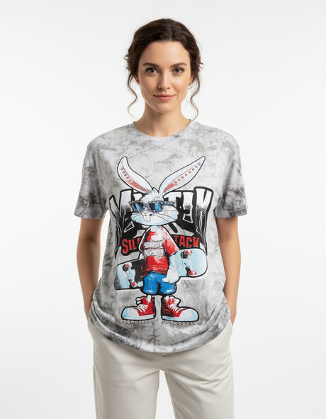 Woman wearing a white tshirt with a cartoon character design on a white background
