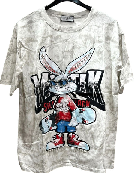 White oversized tshirt with a graphic print of a stylized rabbit wearing a red shirt and holding a skateboard
