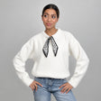 Ivory wool top with a skinny printed neck scarf, worn with light wash jeans