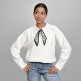 Ivory wool top with a skinny printed neck scarf, worn with light wash jeans
