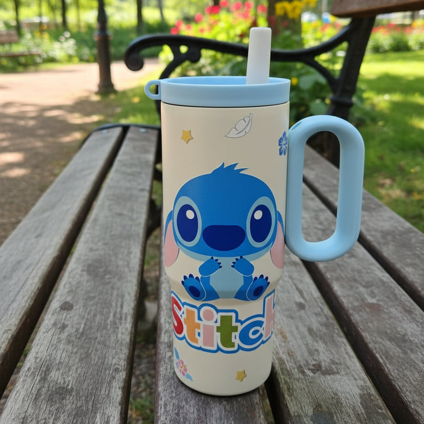 Cream Stitch tumbler with the straw inserted, shown on a wooden park bench