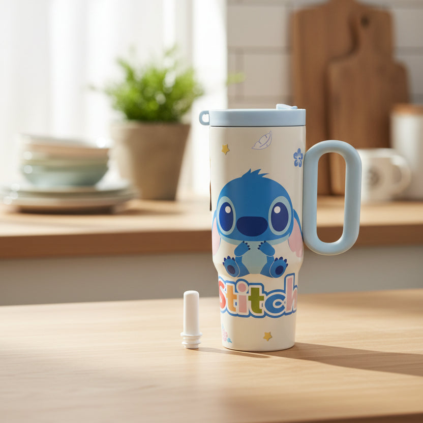 Cream Stitch tumbler with a powder blue handle and lid on a kitchen counter