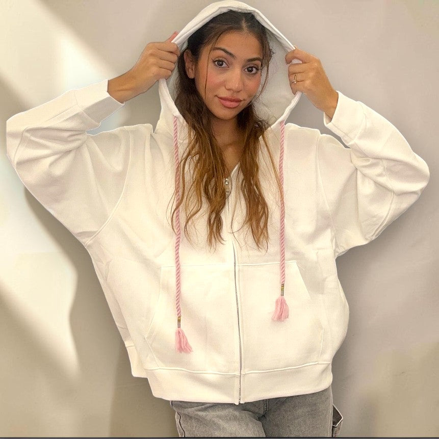 Hood pulled up on the white zip hoodie, showing the deep hood and dropped shoulders
