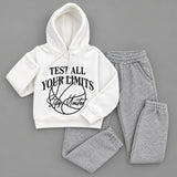 White hoodie with Test All Your Limits print laid out with grey marl joggers
