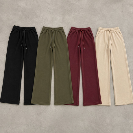 Four pairs of wide leg sweatpants laid flat in black, olive, burgundy and beige